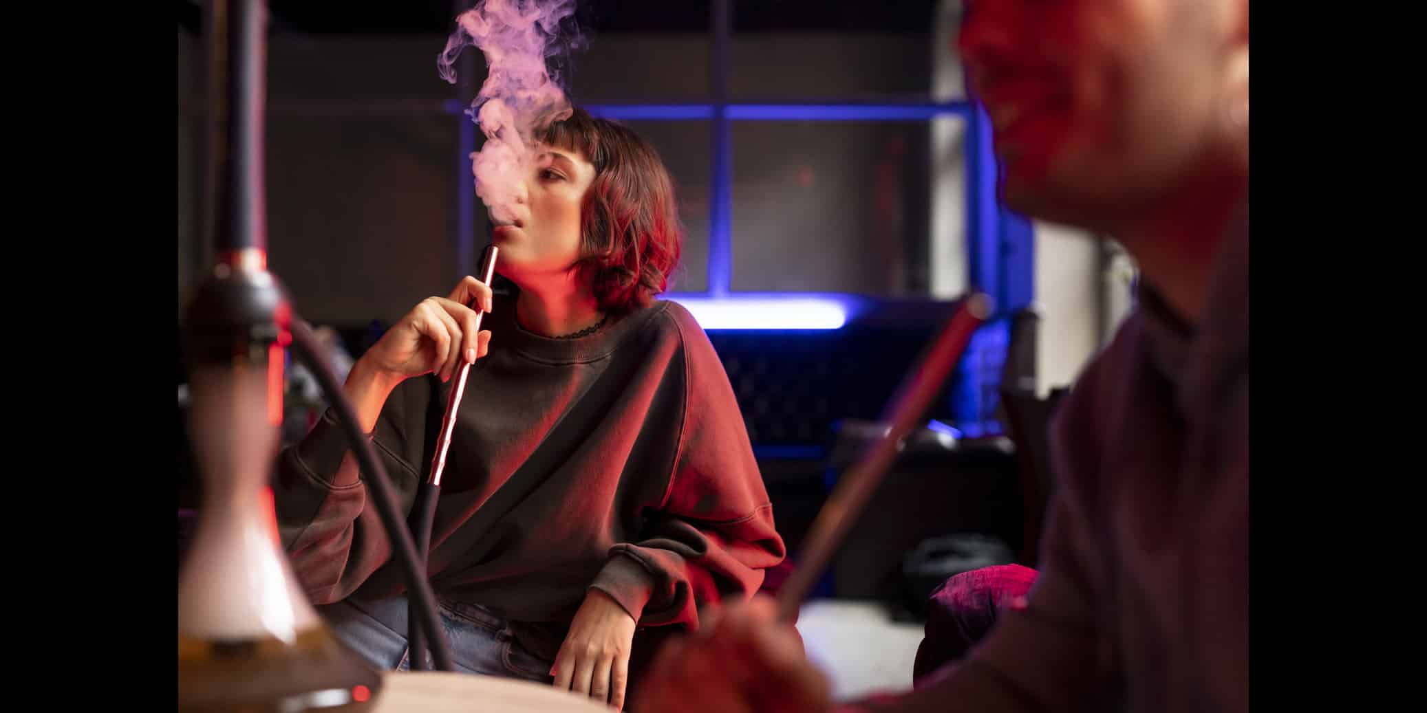 young man woman vaping from hookah indoors 3